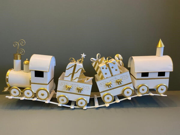 Metal Christmas train. Place small presents or sweets in its carriages and put it on the Christmas table or at the base of a Christmas tree.