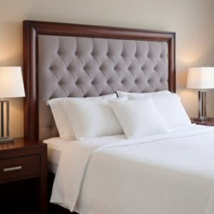 Chesterfield with dark wood surround